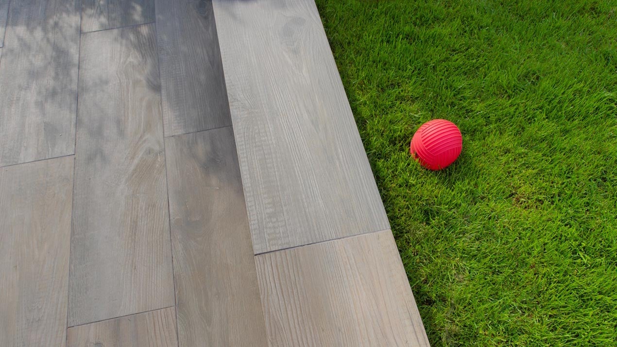 Narrow jointed pointing used here with Crosswood Cinder Porcelain Plank paving.