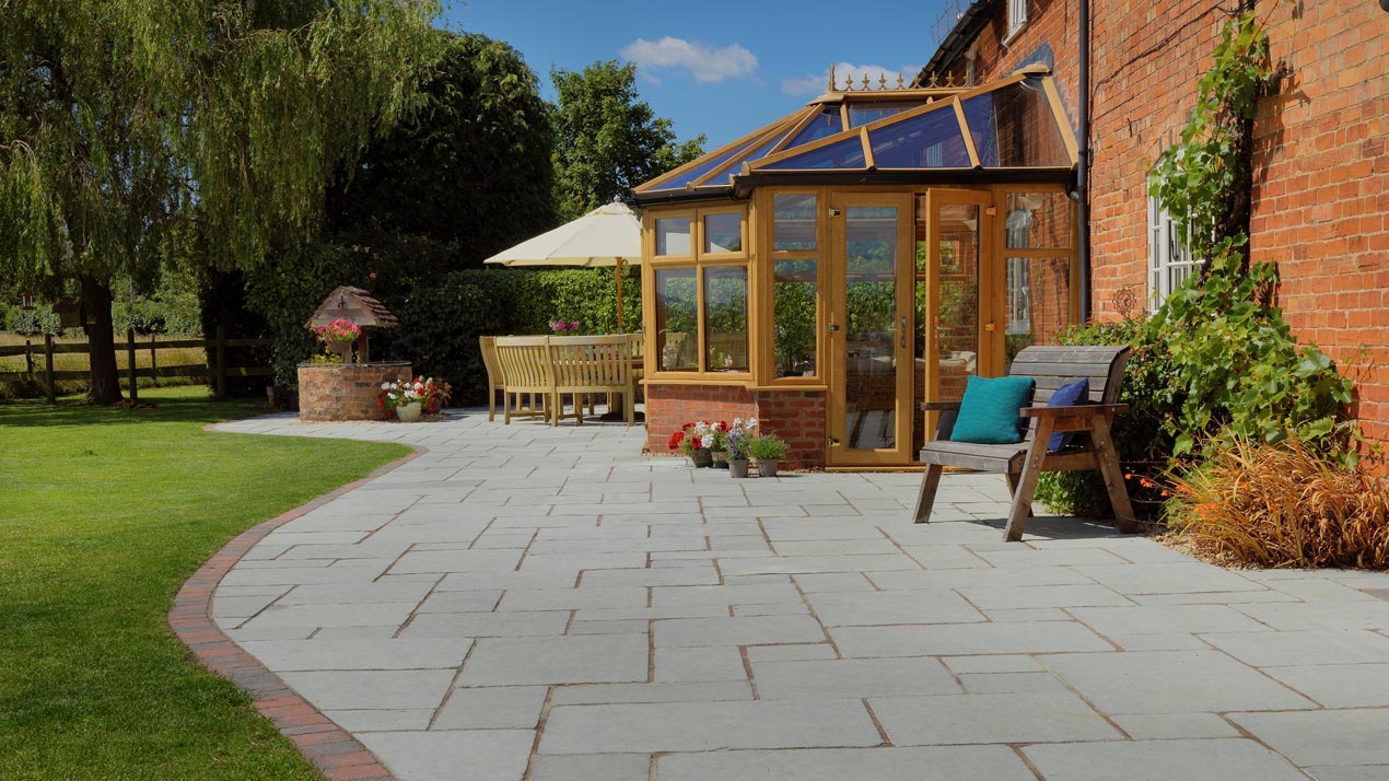 Wide jointed pointing used here with Denby Tudor Antique Limestone traditional flagstone paving.