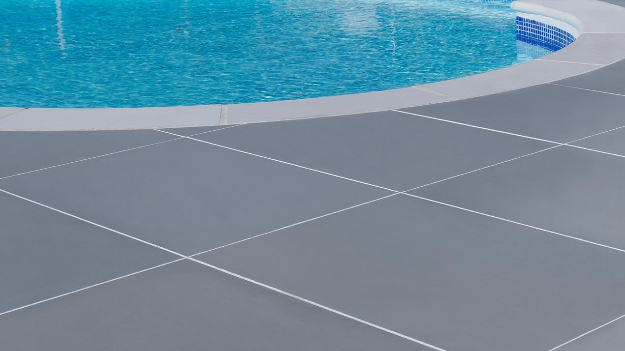 Contemporary style narrow jointed paving - Monviso Grey Porcelain with a contrasting white exterior tile grout pointing.