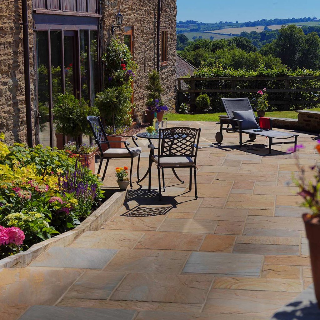 Patio with bright flower bed