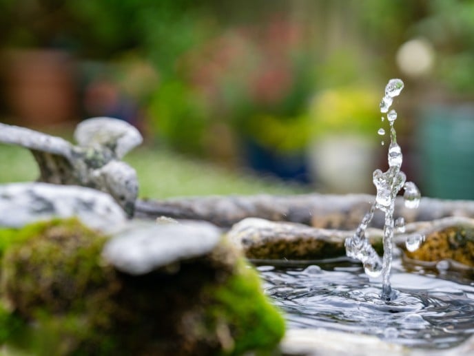 Splosh of water from a garden water feature