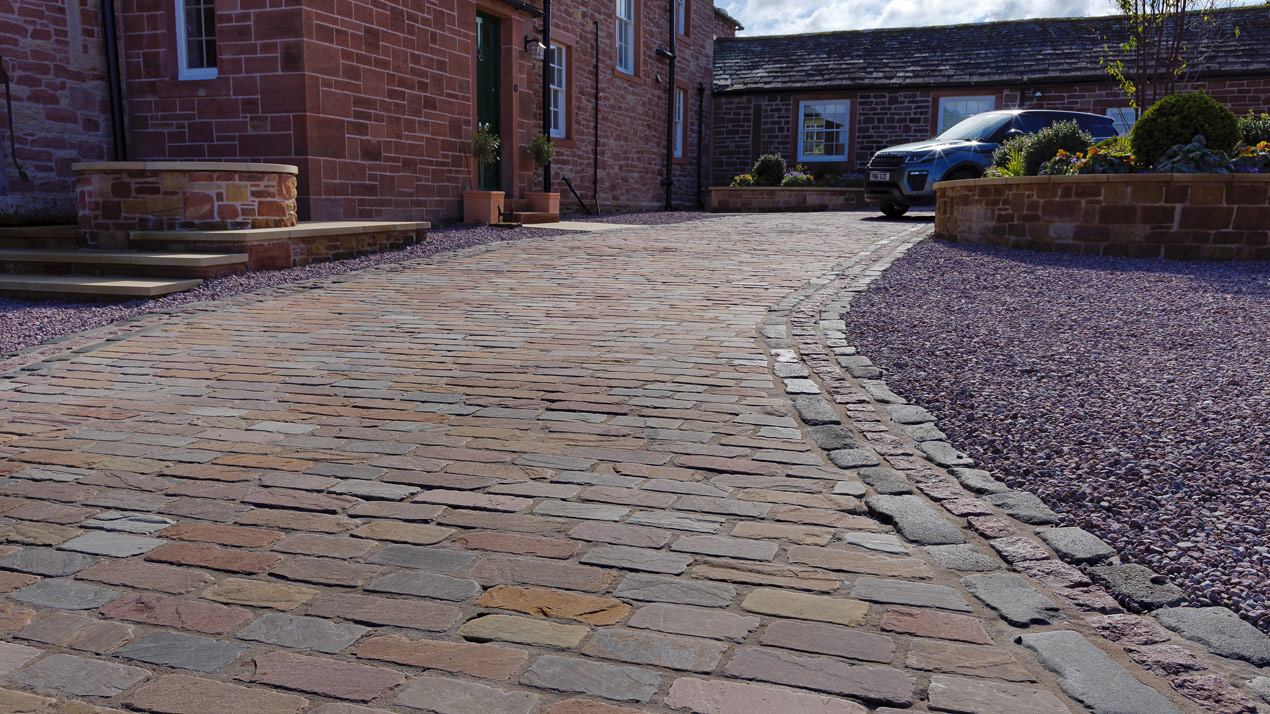 Cobblestone Block Paving Laid in Stretcher Bond with a Triple Stretcher Edge Course